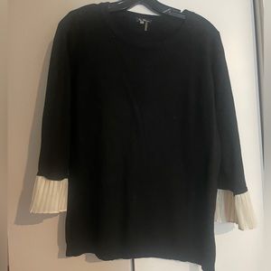 Black sweater with white accent sleeves
